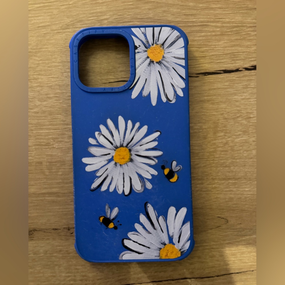 Casetify iPhone 13 Pro Max Case - blue colour with daisies and bumblebees